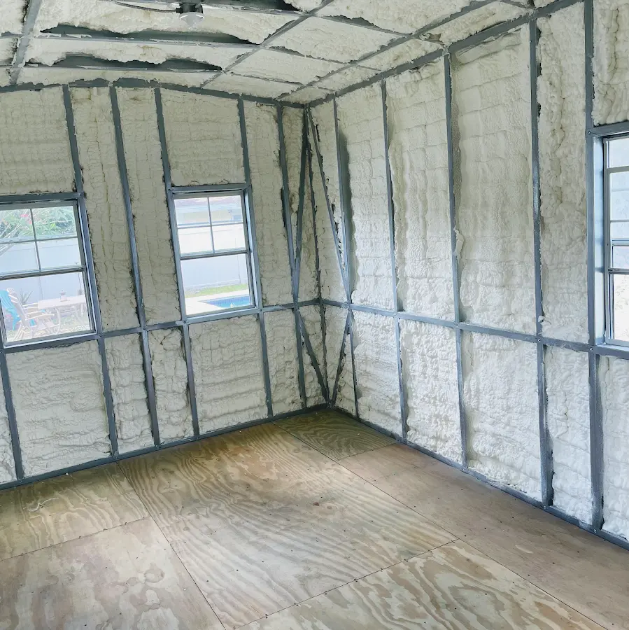 Closed-cell spray foam insulation applied to wall cavities in a residential project in Stuart